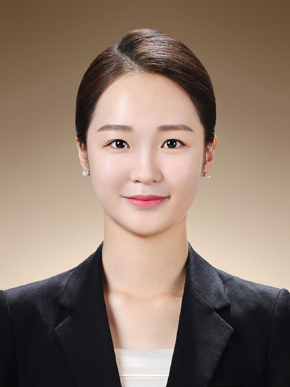 Smiling woman with prominent features posing at Time On Me Studio in Seoul, South Korea.
