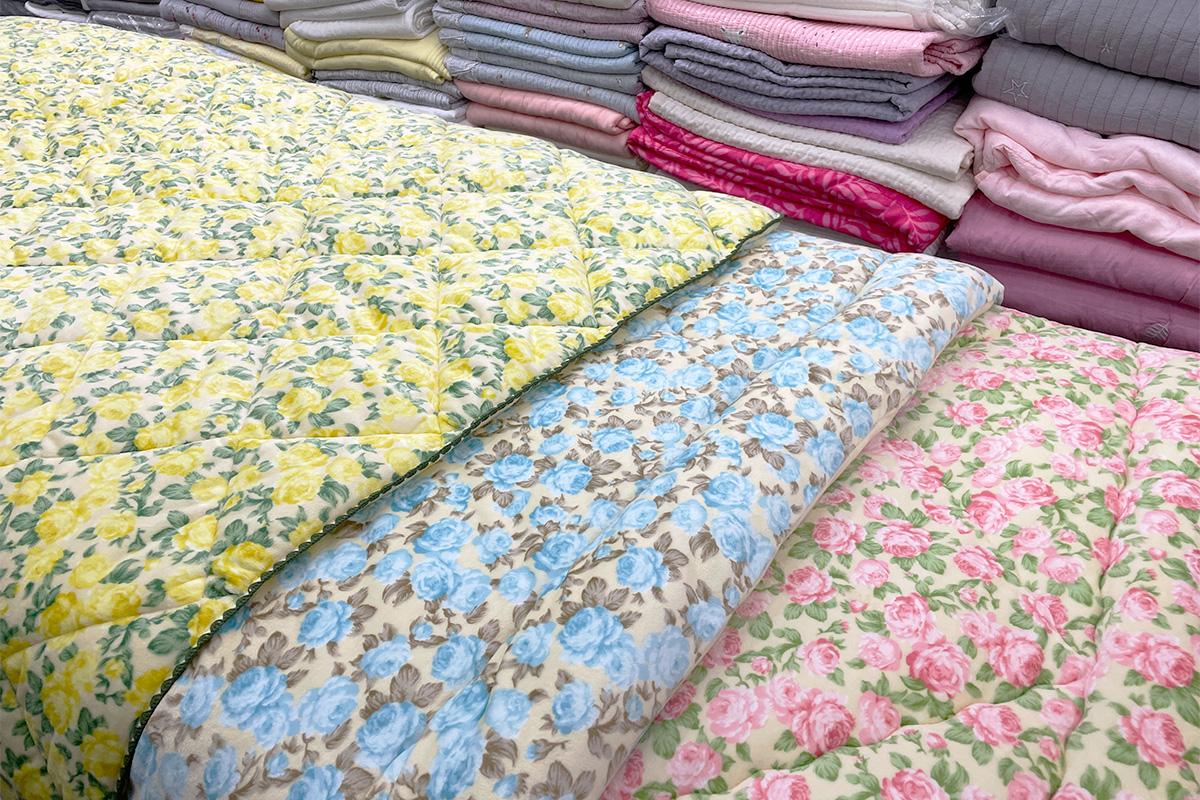 Creative textile patterns, including linens, tablecloths, and beddings at 광장시장 156호 아씨방 in Seoul, Korea.