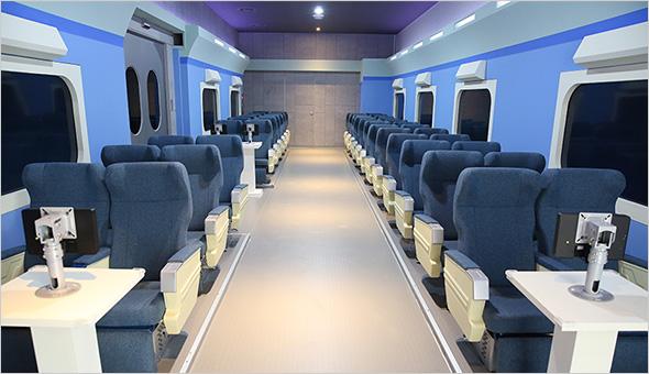 interior of KTX train car with modern design elements and comfortable seating, traveling through Seoul, Korea.