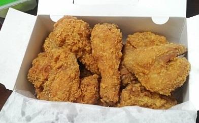 Crispy BHC chicken dish with bread crumb coating and tableware, perfect for delivery or Korean cuisine recipe.