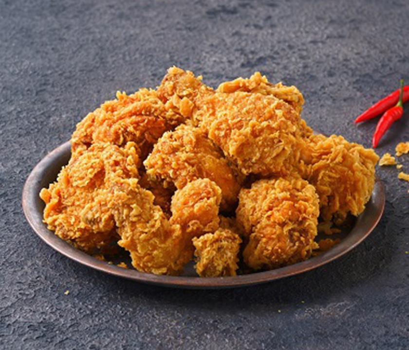 Crispy BHC chicken delivered: a popular Korean fast food dish deep-fried to perfection.