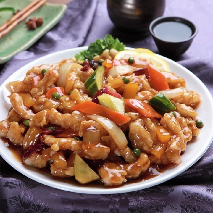 Delicious Chinese food delivery with crispy and savory 탕수육 (Tangsooyook) dish on plate and kitchen tools