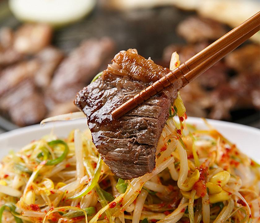 Chinese noodles and ingredients on a table with chopsticks at a restaurant in Seoul's Majang-gol restaurant.