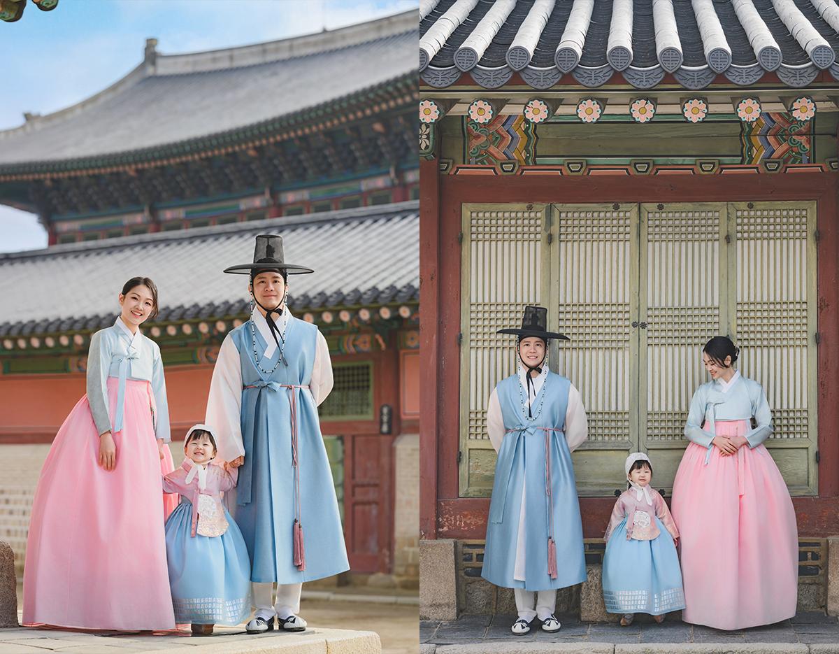 Family in traditional pastel hanbok posing in front of Gyeongbokgung Palace and hanok doors, father wearing gat hat