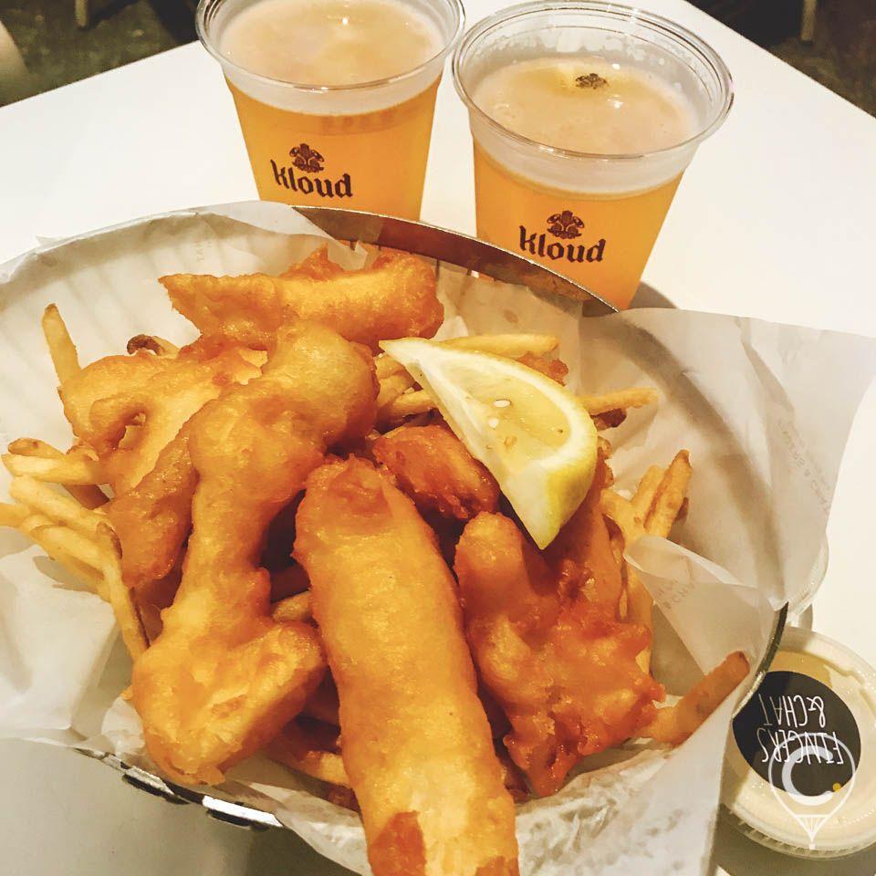 Delicious spread of food and drink including deep fried fish and chips and beer at The Bay 101 in Busan, Korea.