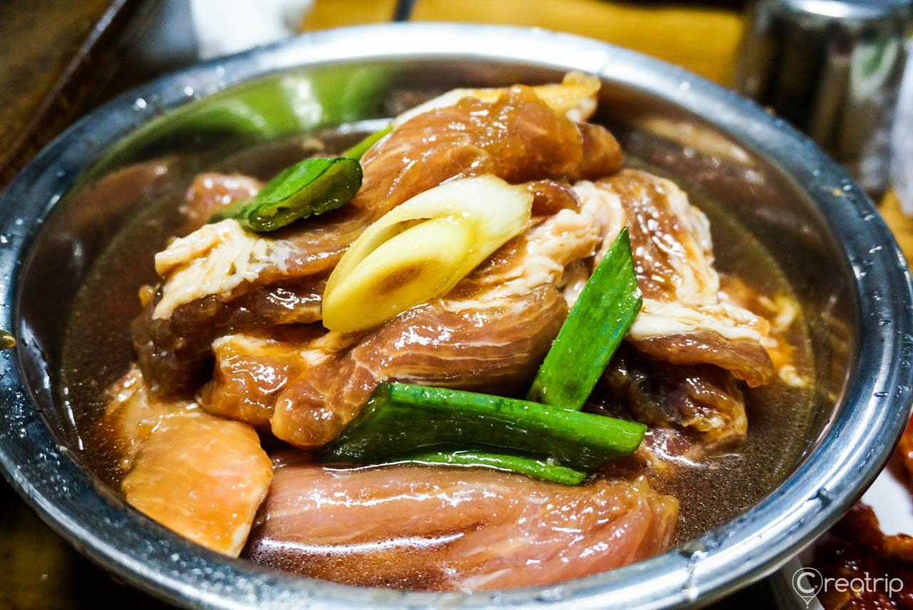 A delicious table spread with Korean pork Galbi before grilled