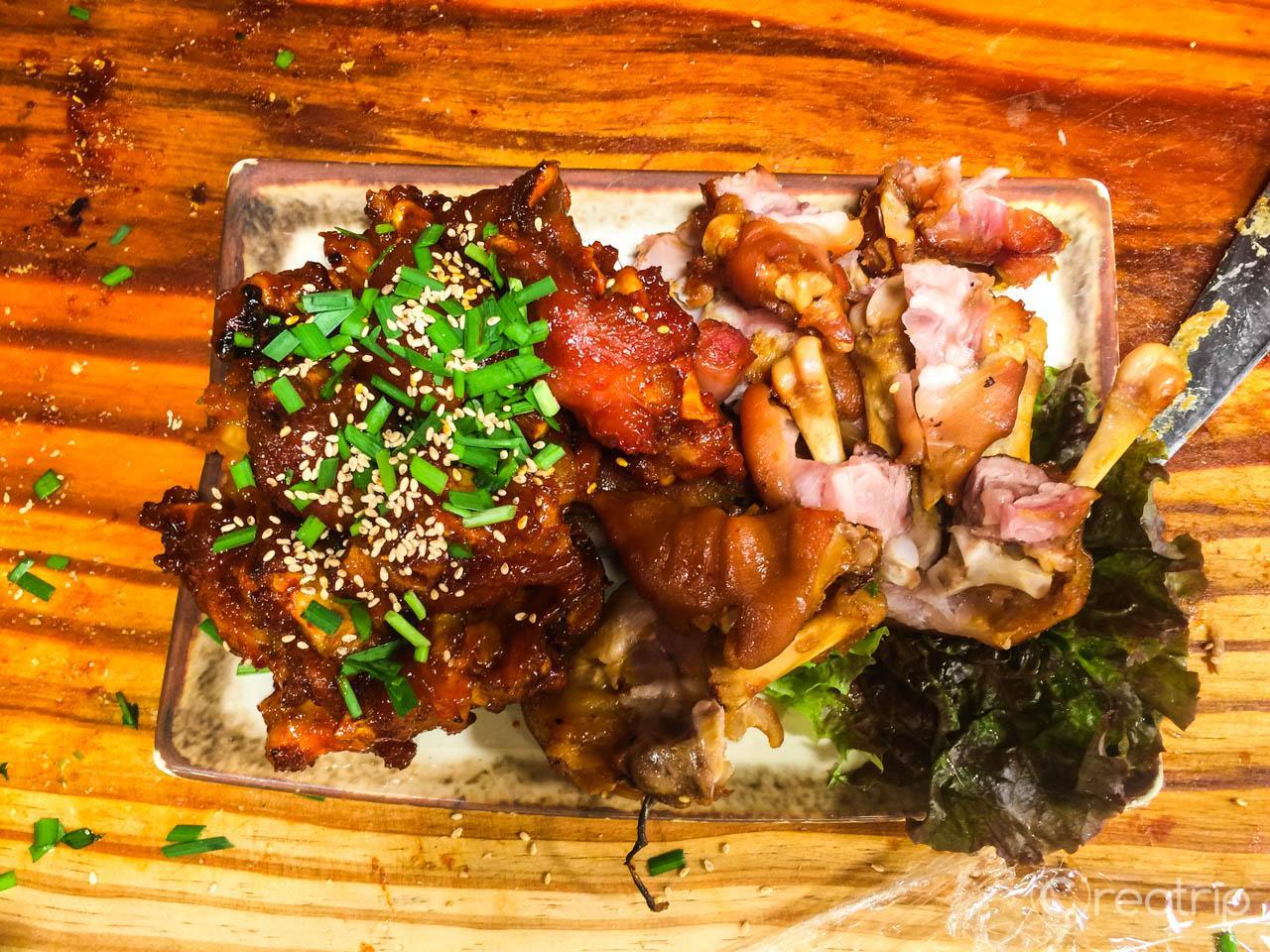 Spicy pork dish with fines herbes and leaf vegetables from Changsin-dong, Korea.