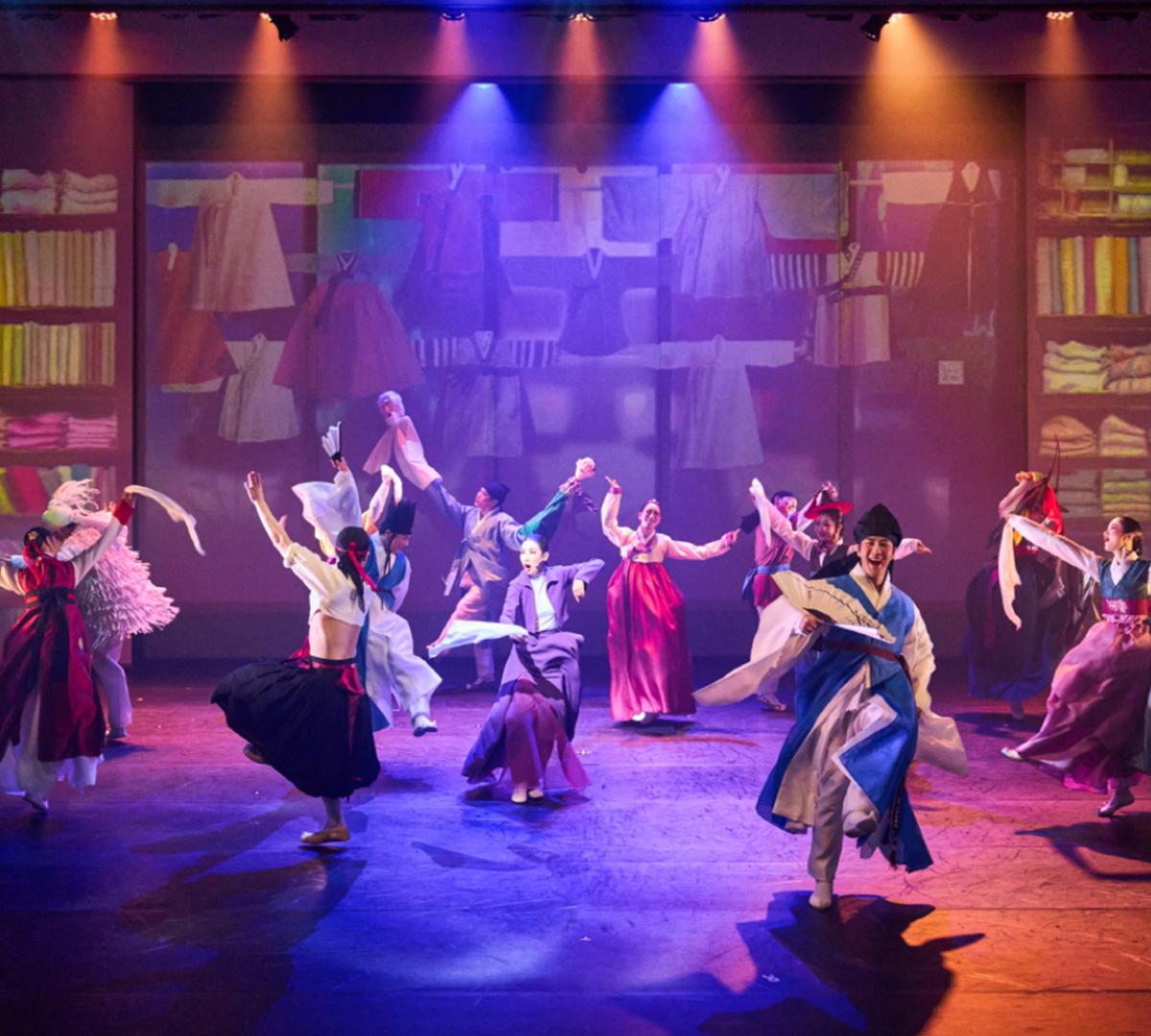stage ensemble in traditional Korean hanbok performing vibrant dance at Seoul National Jeongdong Theater