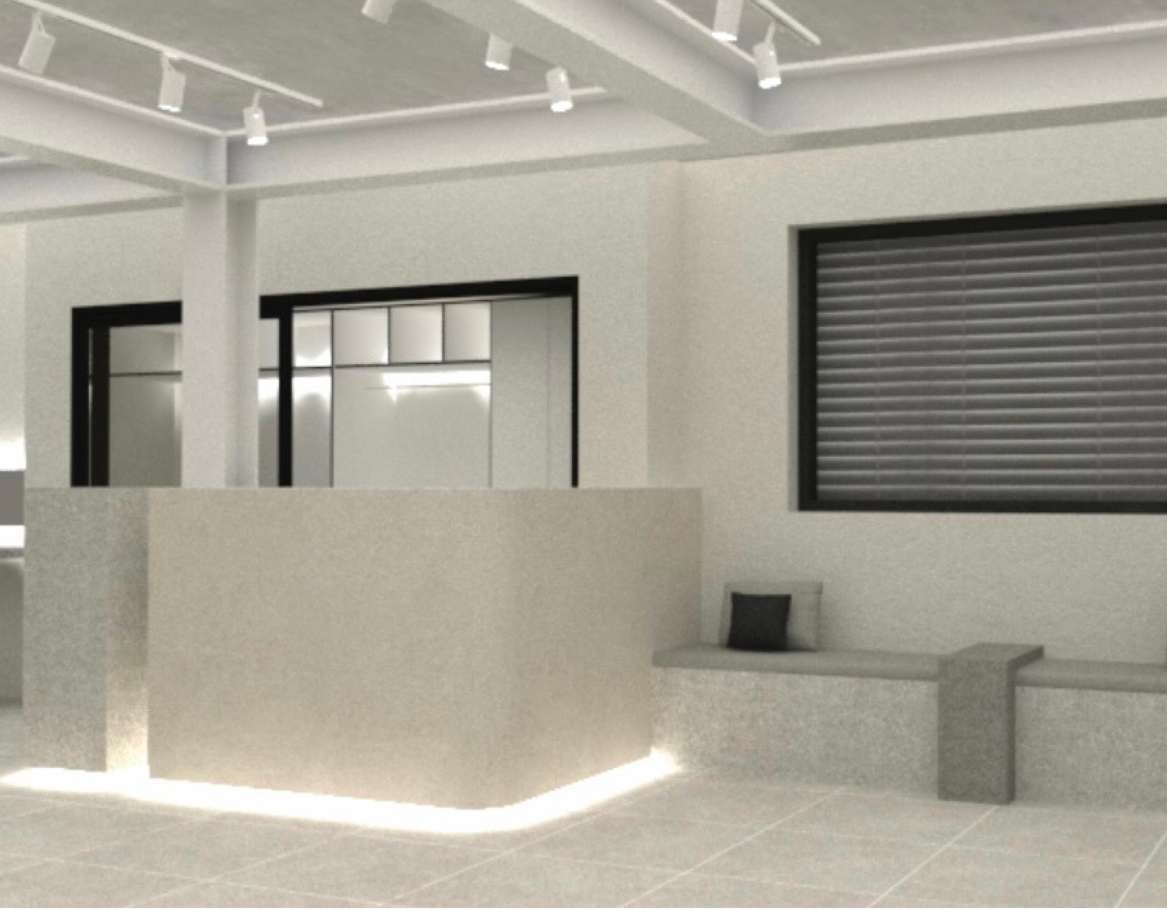 Minimalist salon interior with a beige reception desk lit from below, concrete bench seating and a window with horizontal blinds