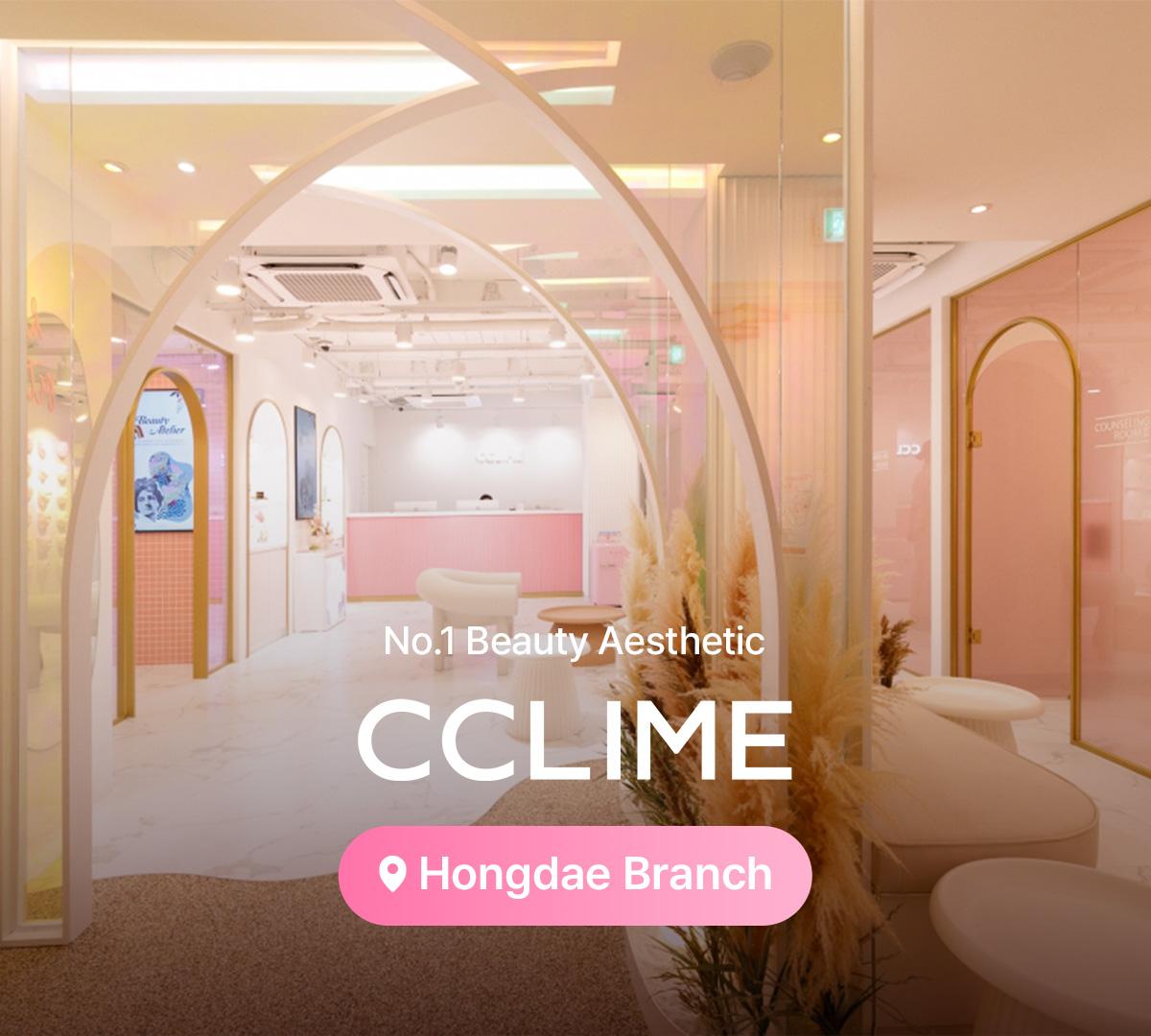 therapist's hands massaging a client's oiled jawline and neck over a gray towel at a beauty esthetic clinic