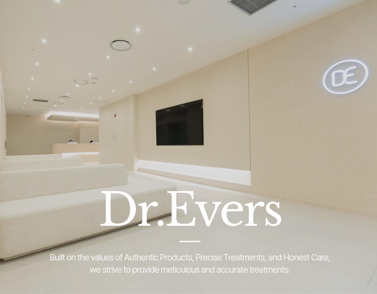 Minimalist cream-toned clinic waiting area with low sofas, wall-mounted TV, Dr.Evers logo and reception desk in background