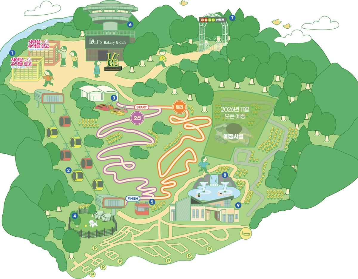 illustrated map of Ganghwa Luge park showing cable car line, two winding luge tracks (Ocean and Valley), cafe, viewing deck, fountains, parking and forest trails