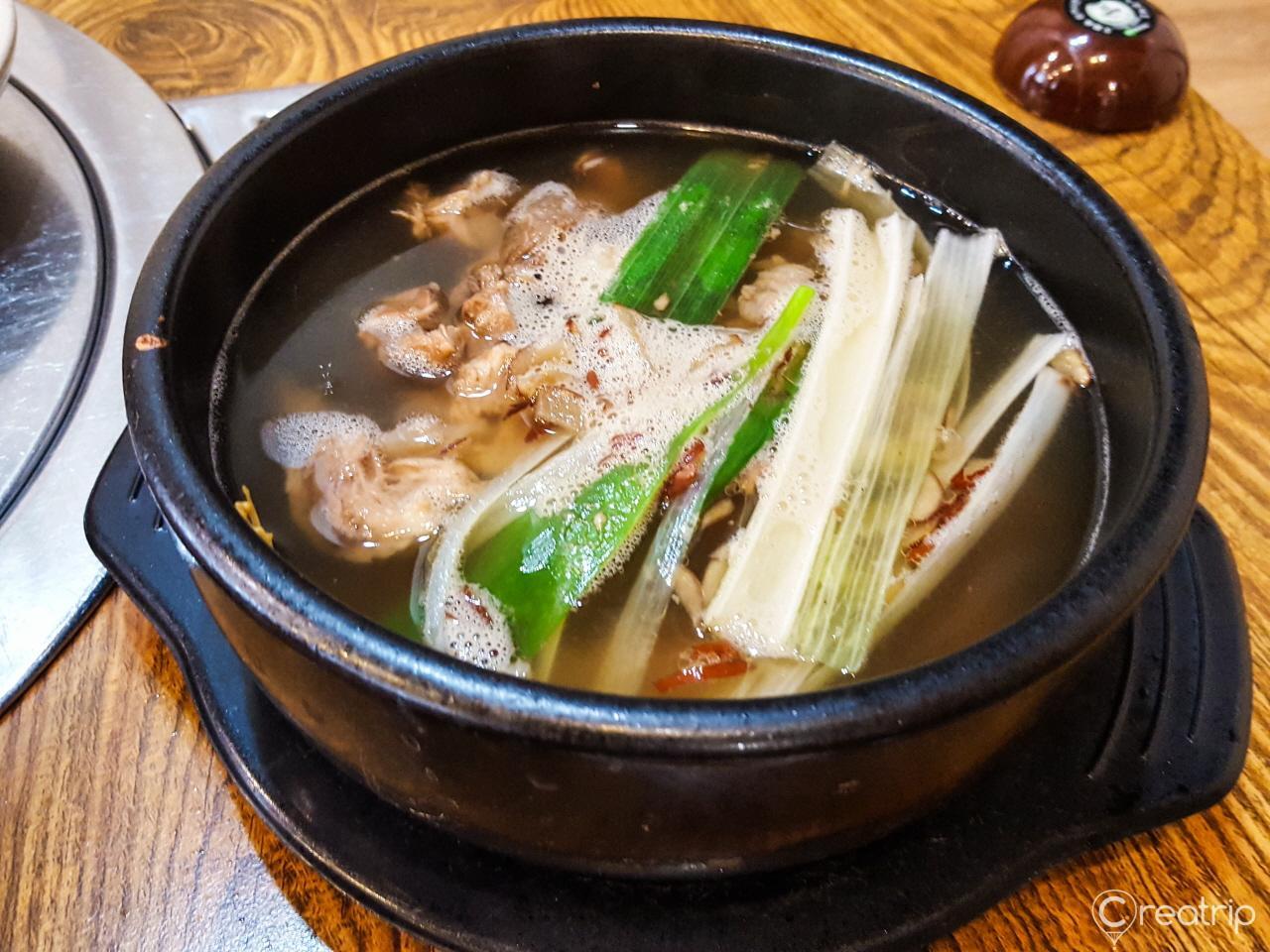 Seafood and vegetable stew served on tableware at 함평면옥 restaurant in Korea.