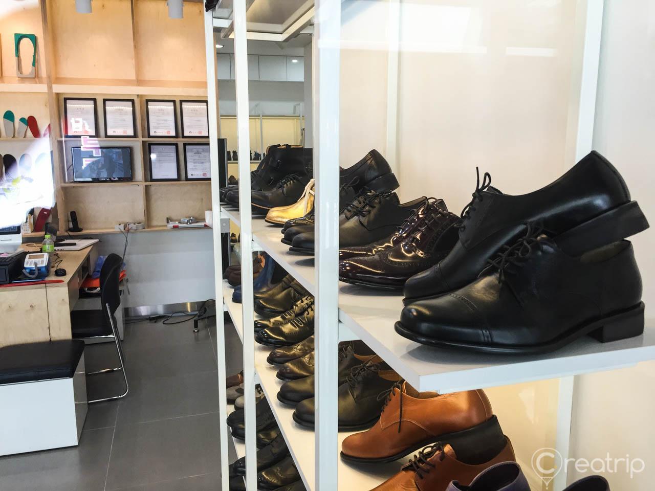 Handmade walking shoes on display at outdoor footwear shop in Seoul's trendy Seongsu neighborhood.