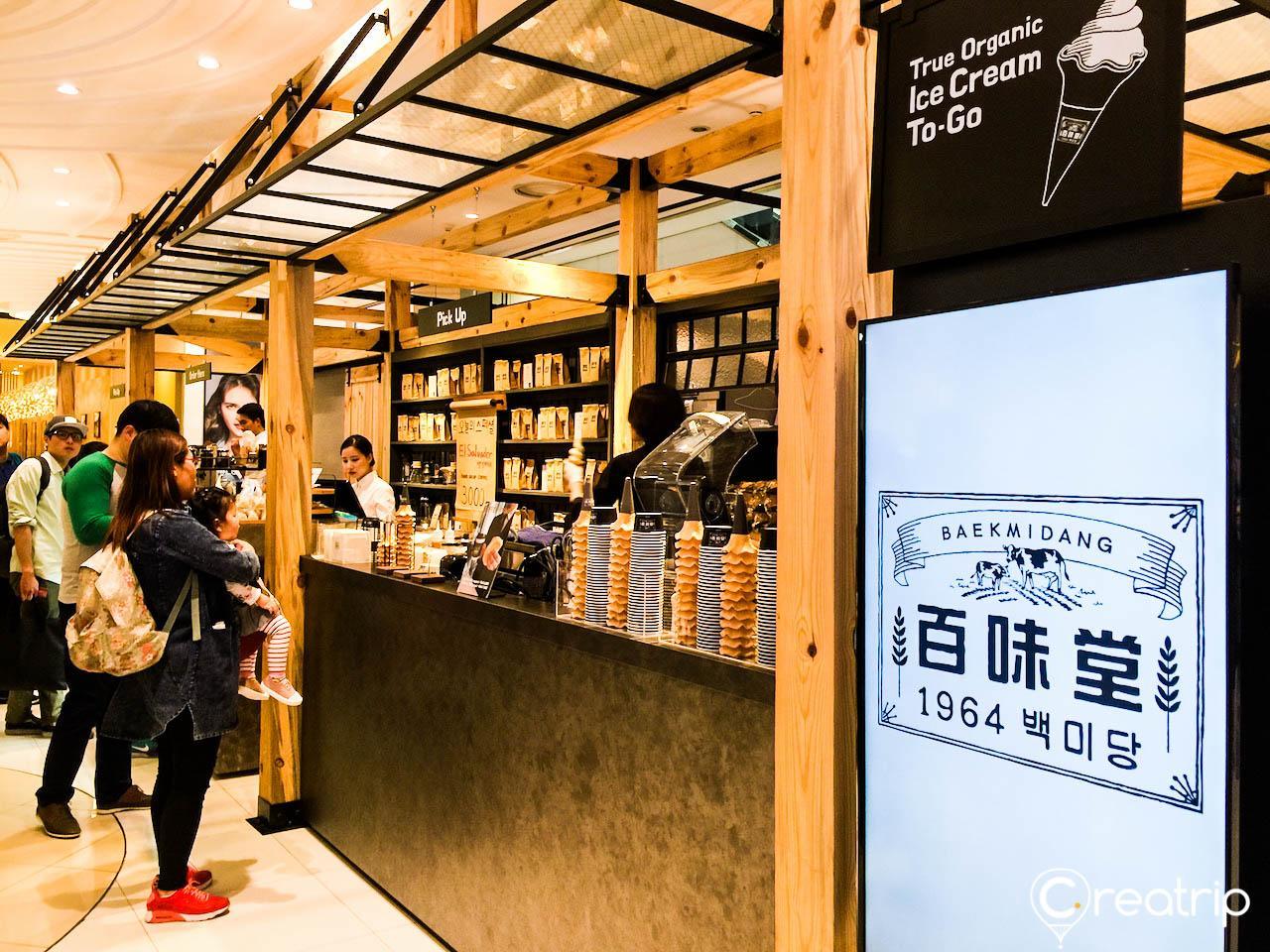 Interior of retail store of Baekmidang with multiple shelves located in Seoul's Times Square building.