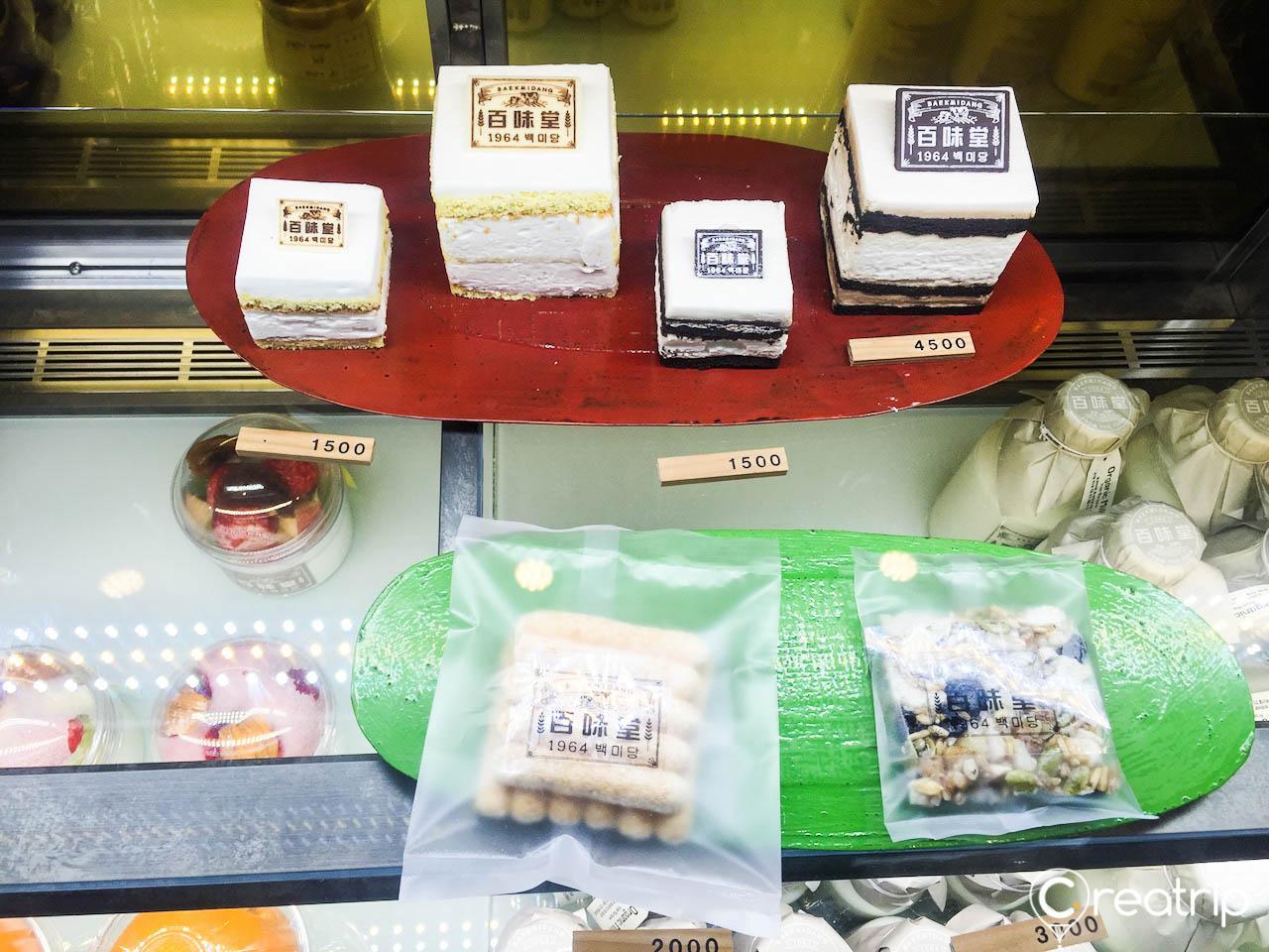 A display of decadent desserts and natural ingredients from Baekmi-dang at the Times Square location in Seoul, Korea.