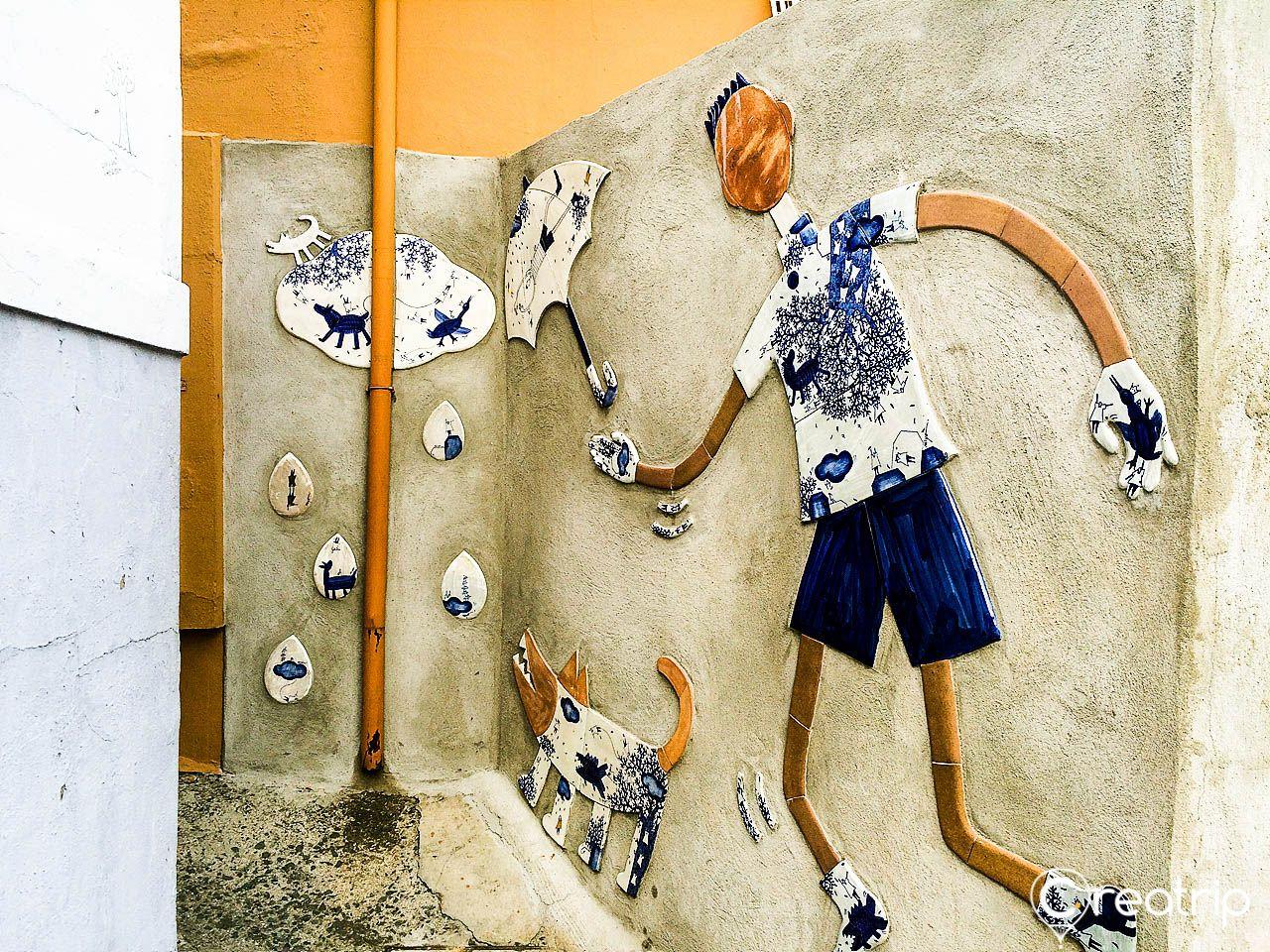 blue patterned artwork on concrete background in 감천문화마을, Korea.