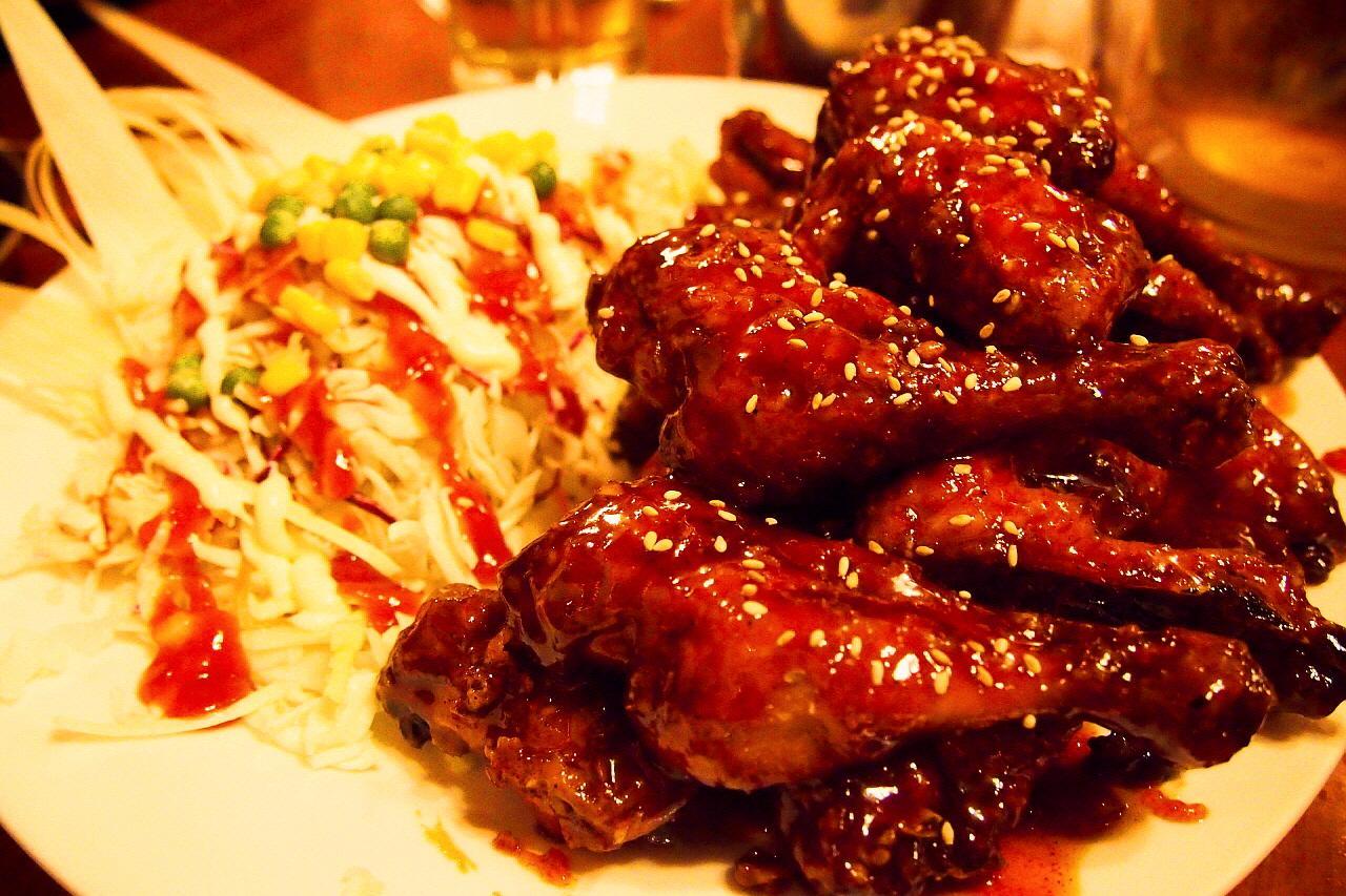 Delicious brown chicken hof with tableware and ingredients, including fried chicken meat and oyster sauce.