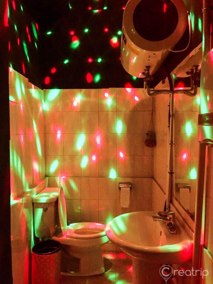 Green interior design with vivid lighting and plumbing fixtures in Seoul building