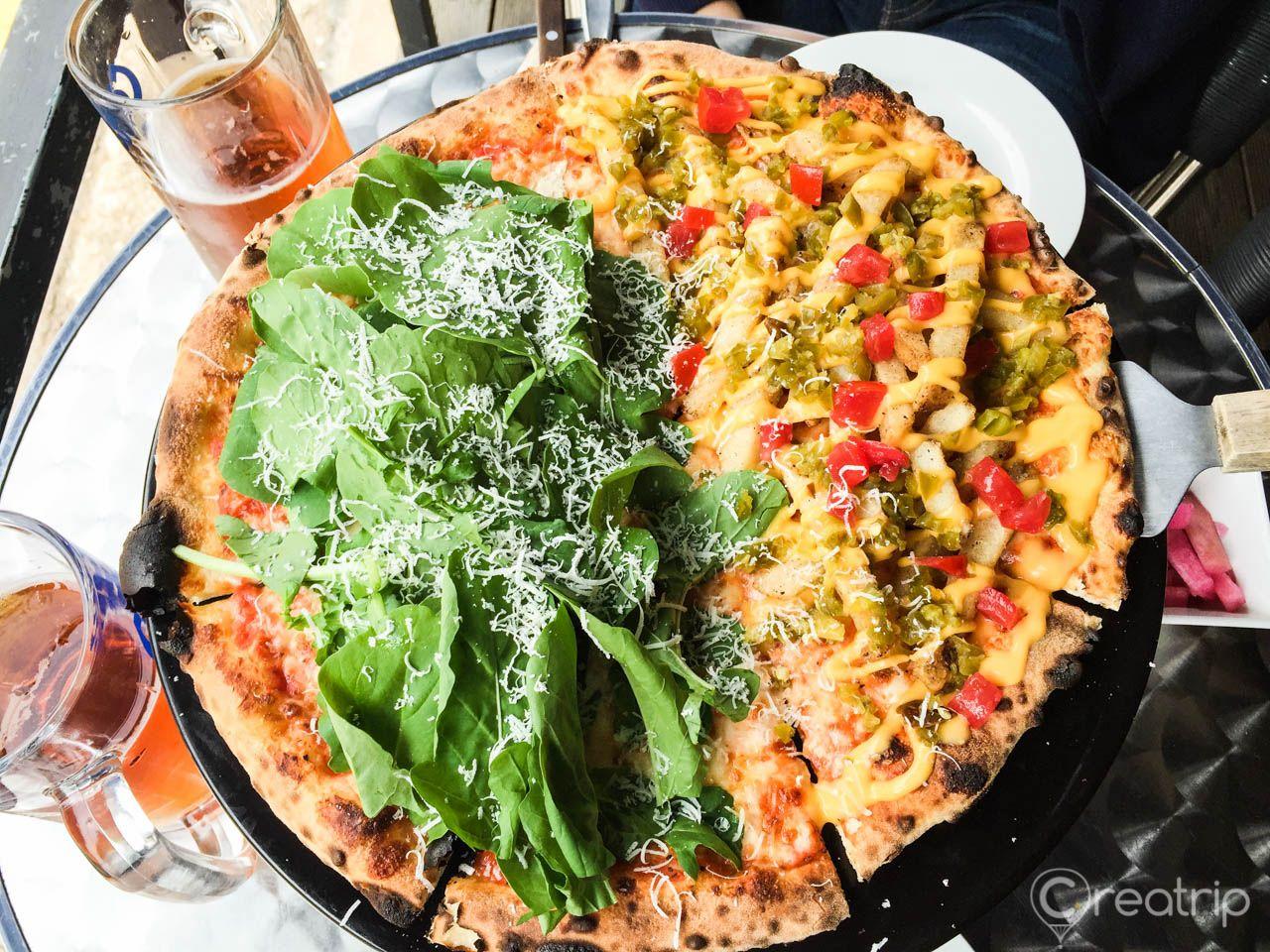 8 Piece Pizza with Salad and Bay Breeze Cocktail on Tableware and Plate.