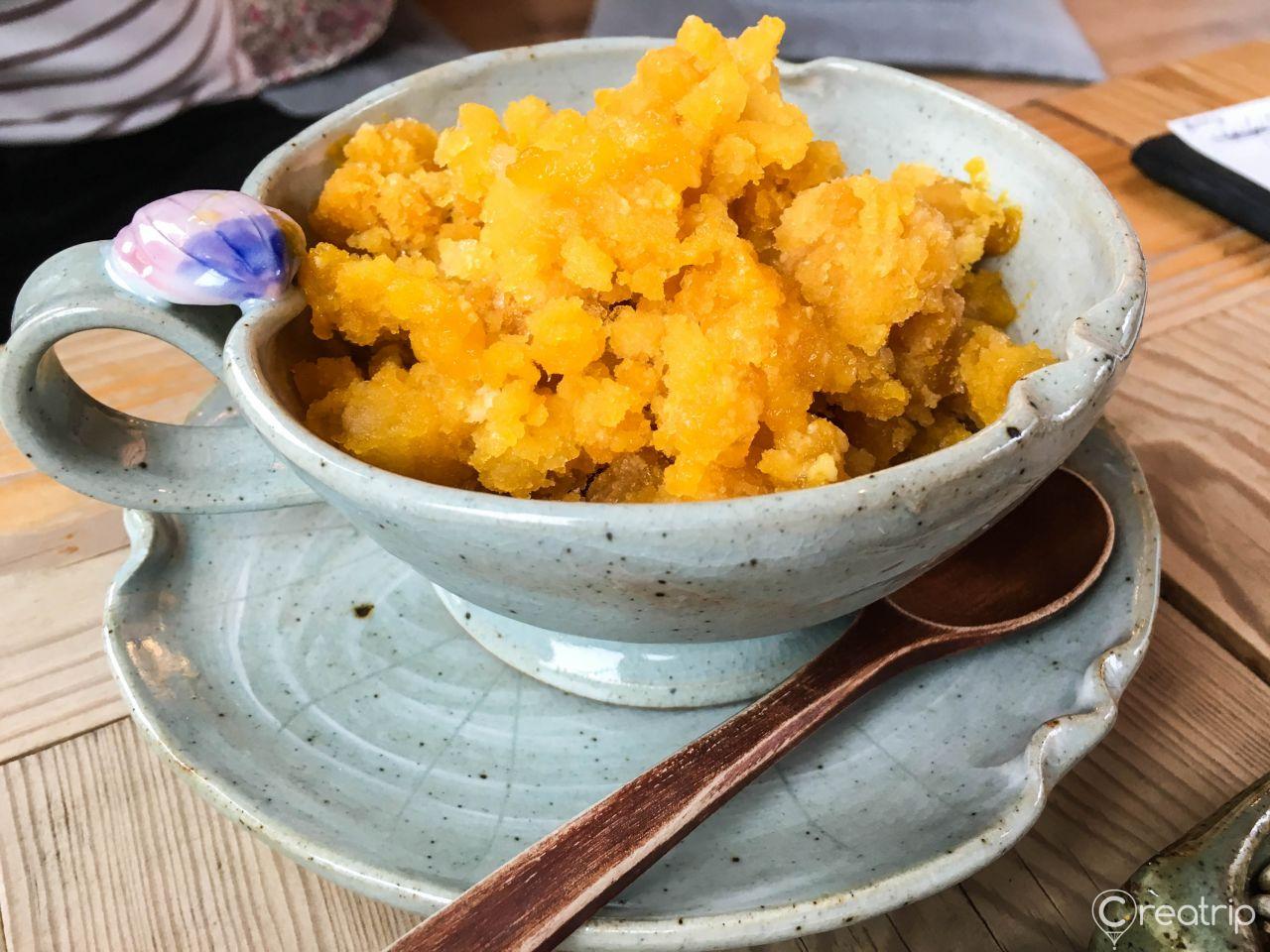 Plate of Korean cuisine with food, tableware, and kitchen utensils.