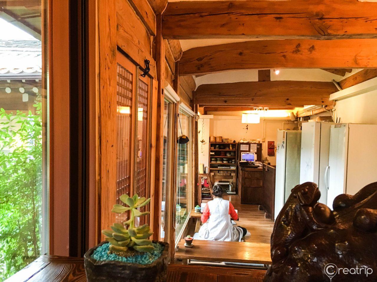 Indoor plant in a cozy Korean home with hardwood floors and ceiling