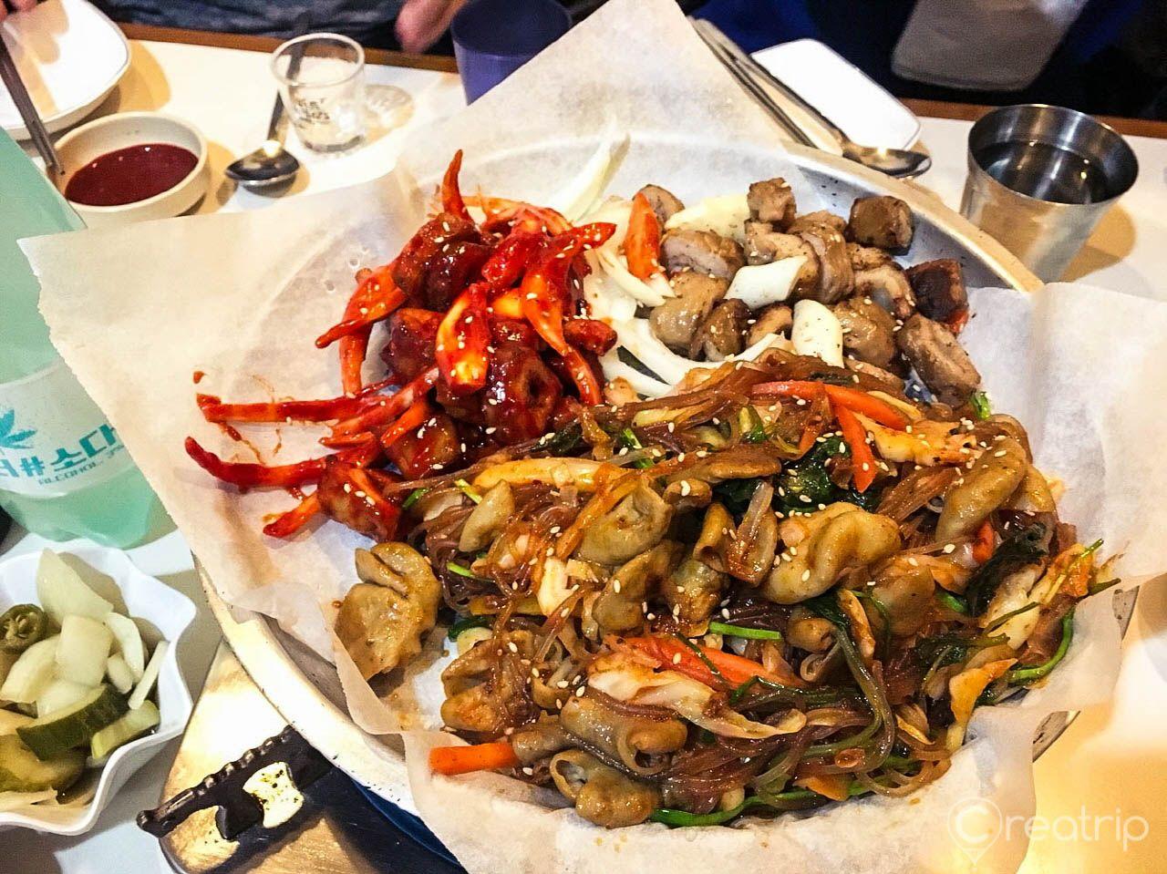 A plate of seafood and meat dishes at 이모네곱창 restaurant in Seoul, Korea.
