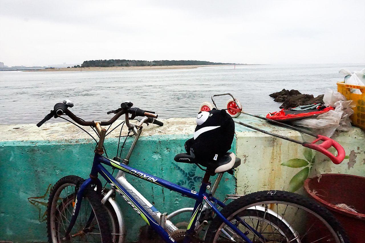 bicycles with tire and handlebar in 가덕도 정거마을, overlooking the water and sky in Busan, Korea.