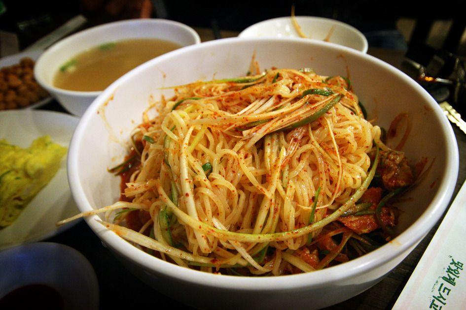 Noodle dish with 풍남골뱅이 on a plate, served as a staple food in Seoul, South Korea.