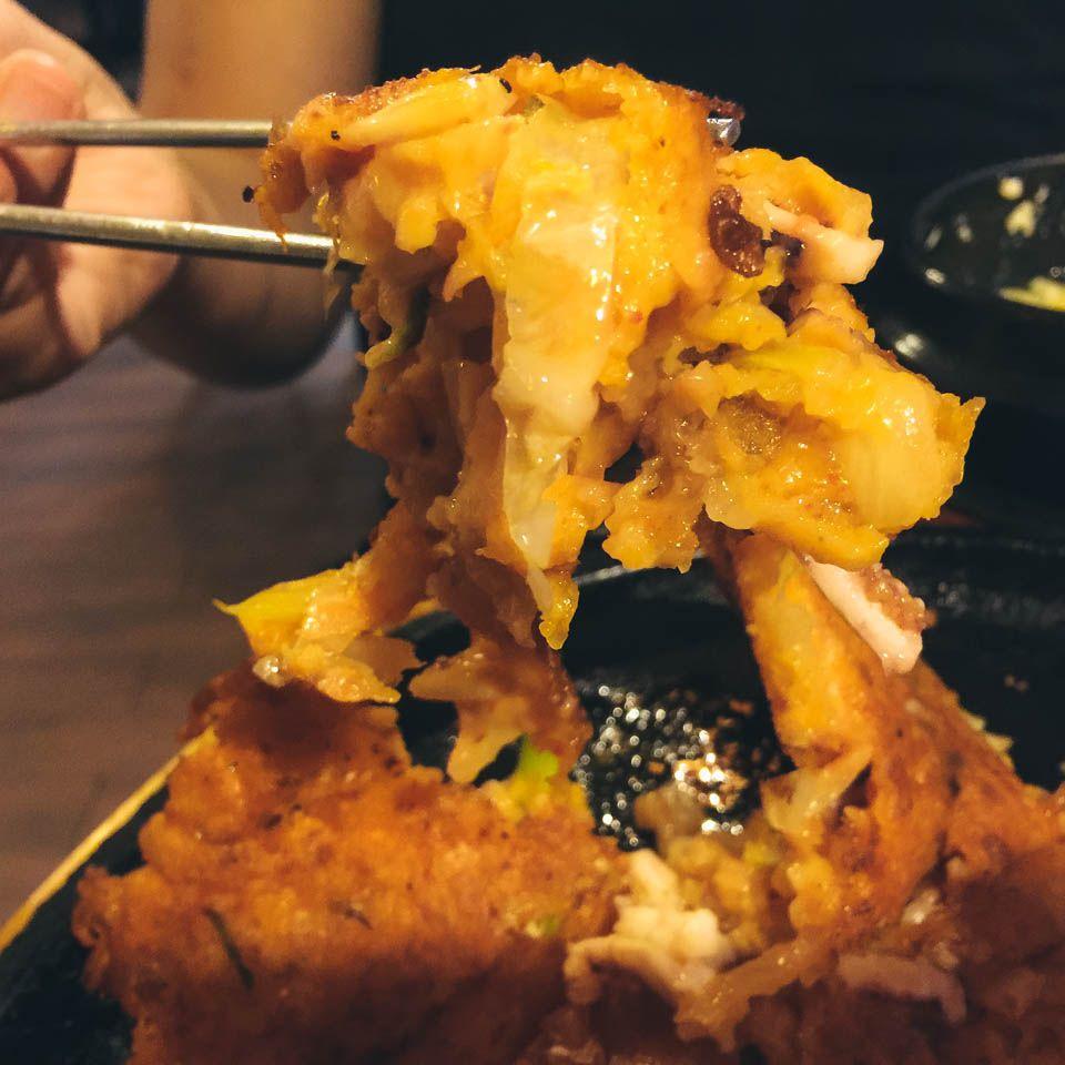 korean street food staple: fried 파전골목 (green onion pancake) with meat and vegetables.