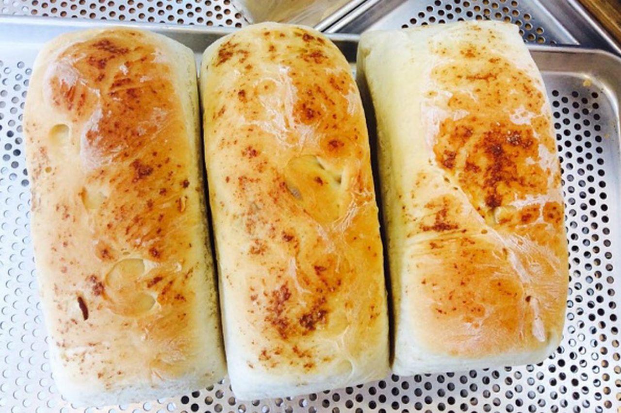 Bread bun with fines herbes and MiSo bread with recipe ingredients on display.