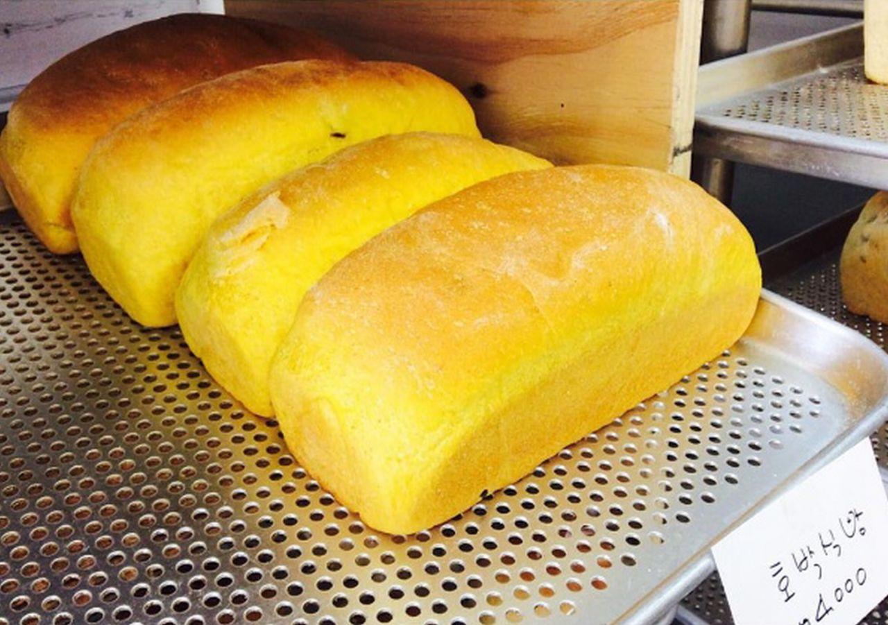 Yellow MiSo bread loaf, a staple food in Korean cuisine, made with produce and baked goods.