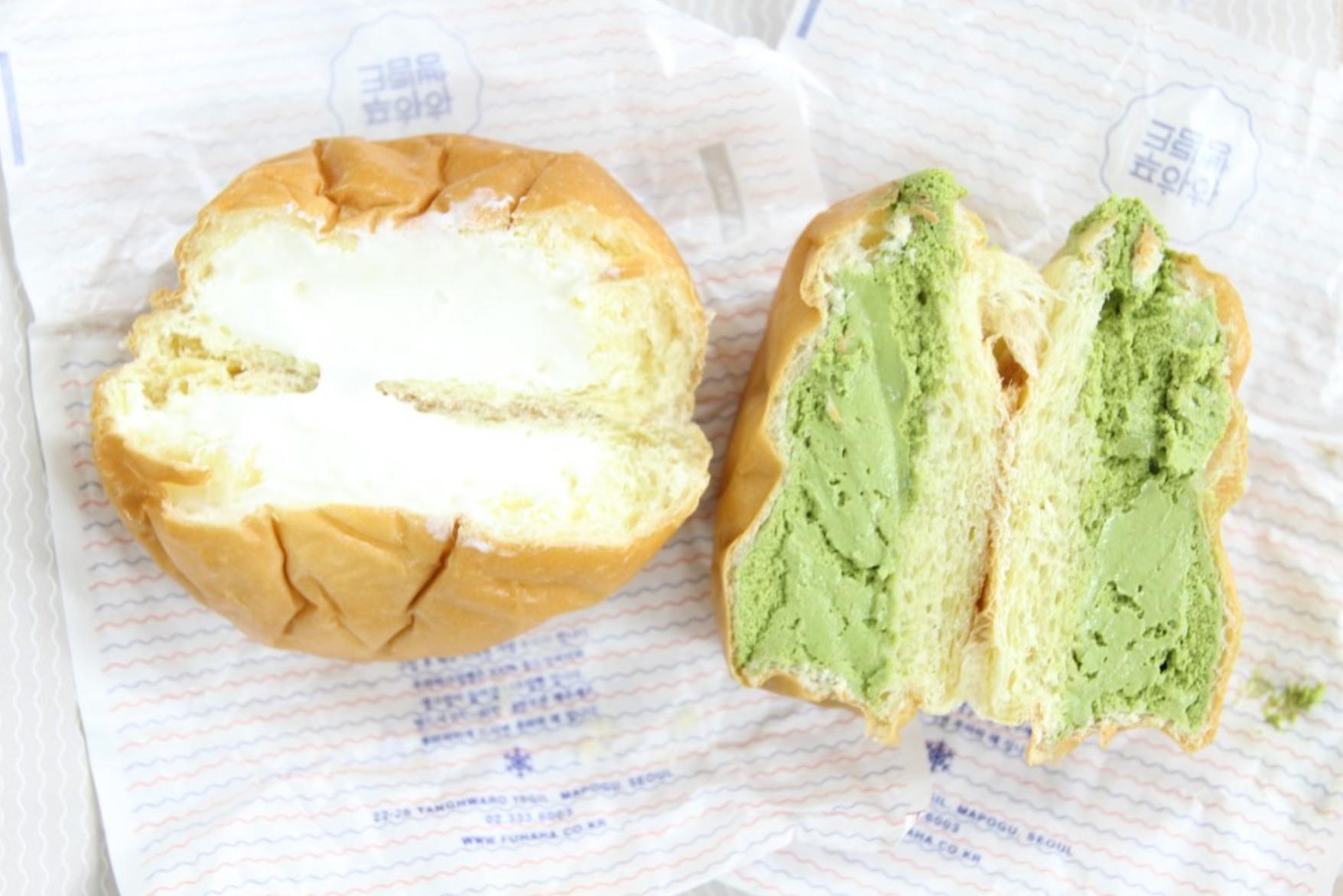 A mouth-watering image of 푸하하크림빵 (cream bread) from a Korean bakery, featuring a soft bun filled with delicious ingredients.