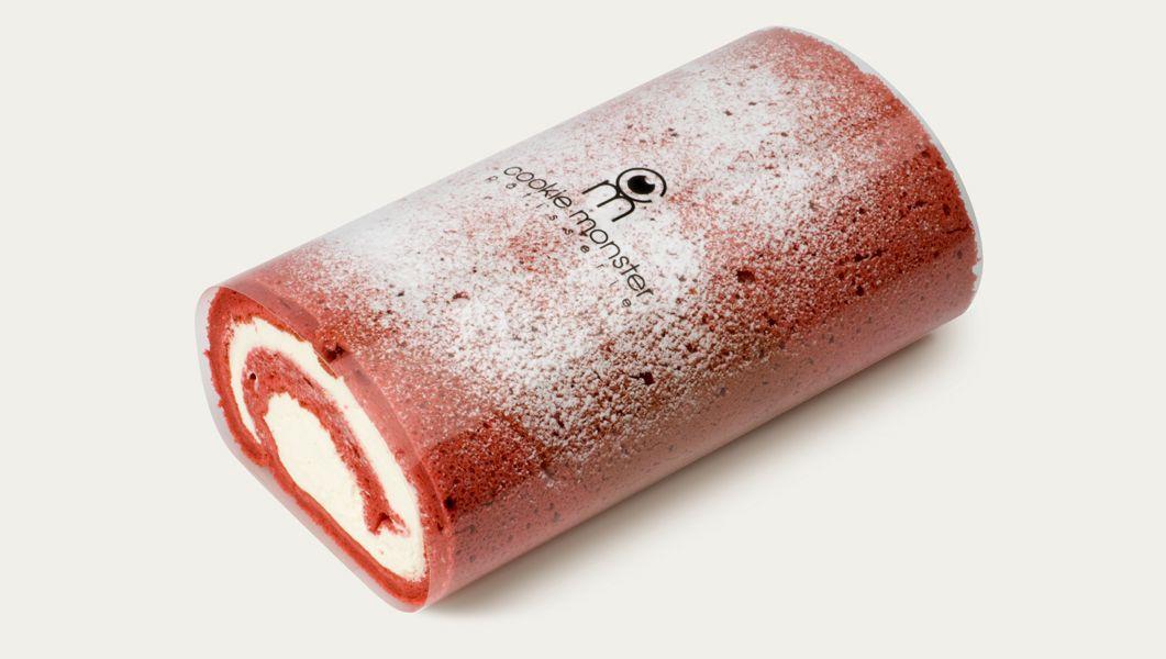 Cookie monster rolled cake with magenta fluid filling and metal fashion accessories.