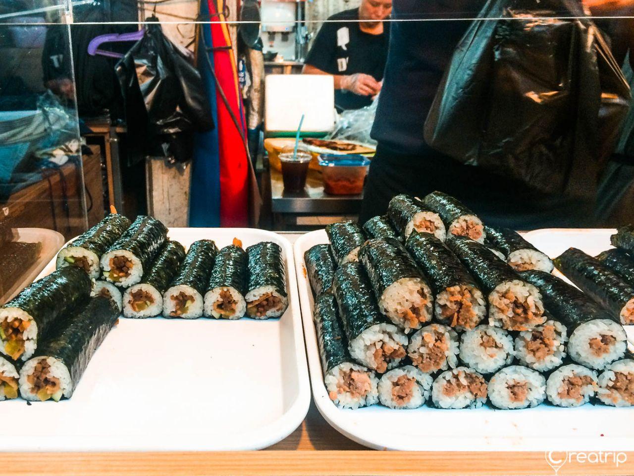 Colorful gimbap rolls with fresh seafood and vegetables at 서문시장 in Seoul, Korea.