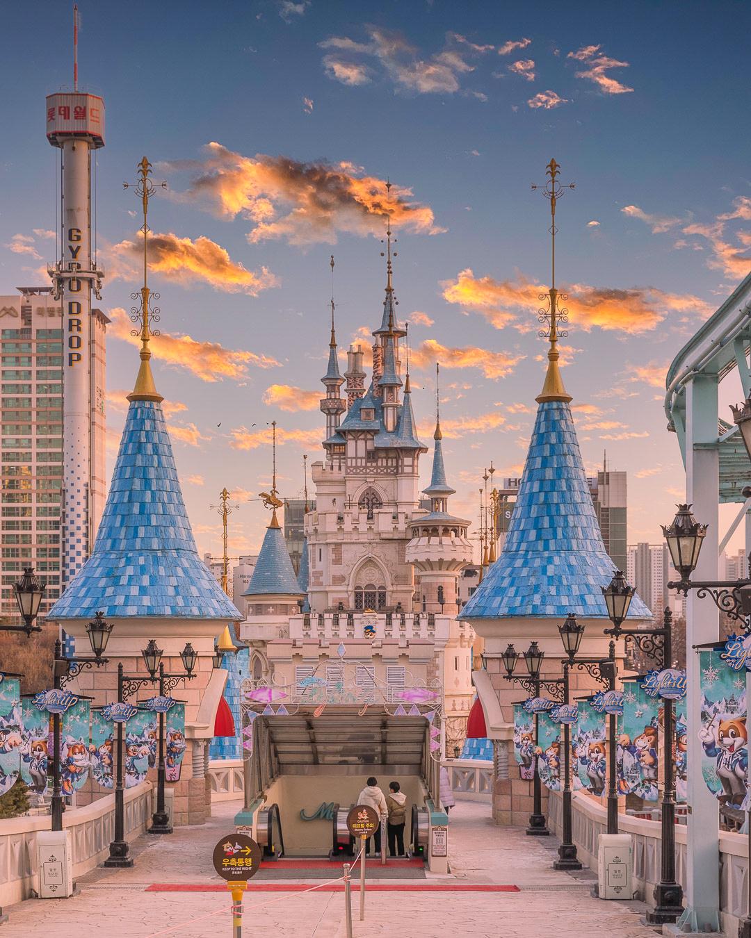 Enjoy the sights of Seoul at Lotte World with a daily pass. Clouds and temples create a stunning skyline against the city.