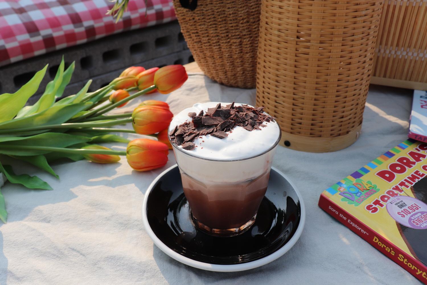 rooftop cafe with delicious food, tableware, and cups on a table in Korea.