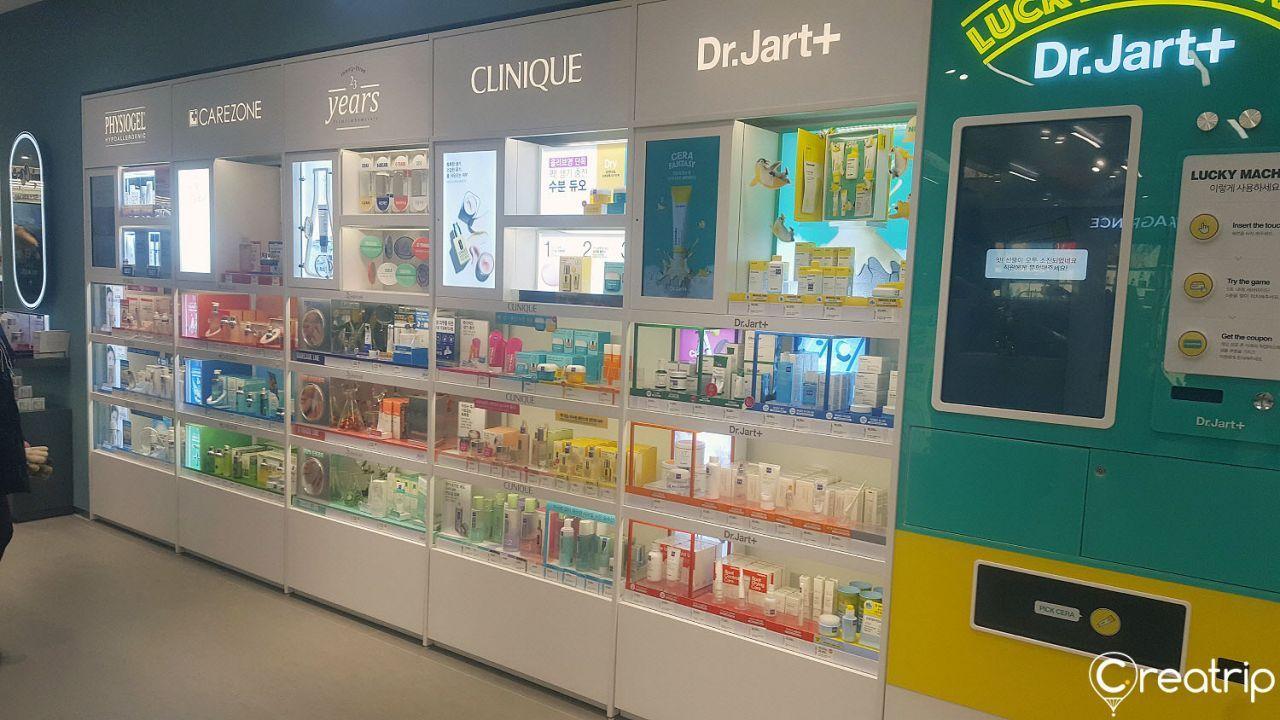 Display of various retail products on shelves at Olive Young store in Hongdae station.