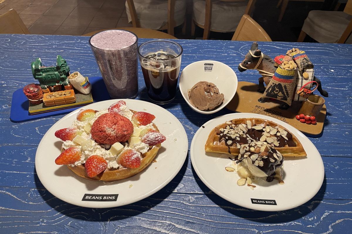 A dessert cafe table set with ingredients, plates, and serveware at Beansbins in Myeongdong, Korea.
