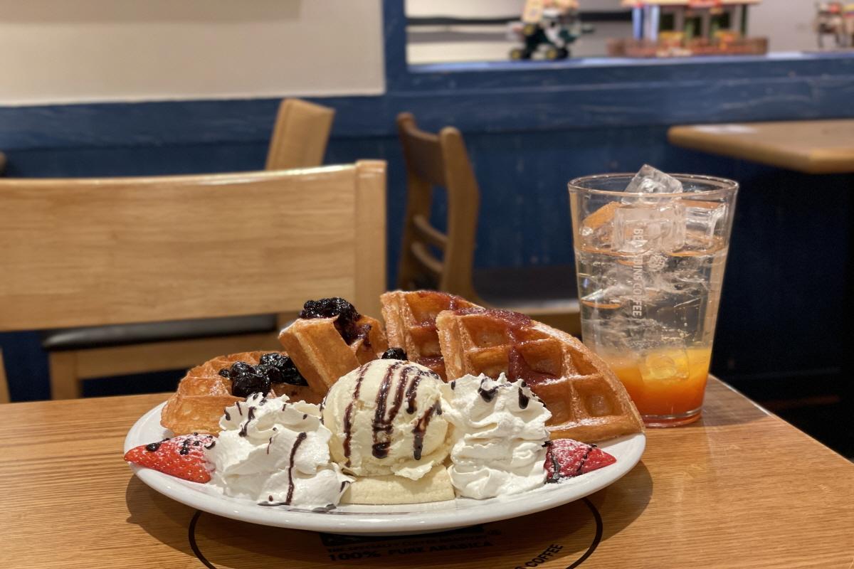 Delicious dessert served on a table at Beansbins cafe in Myeongdong, South Korea. Dessert includes ice cream, plates, and tableware.