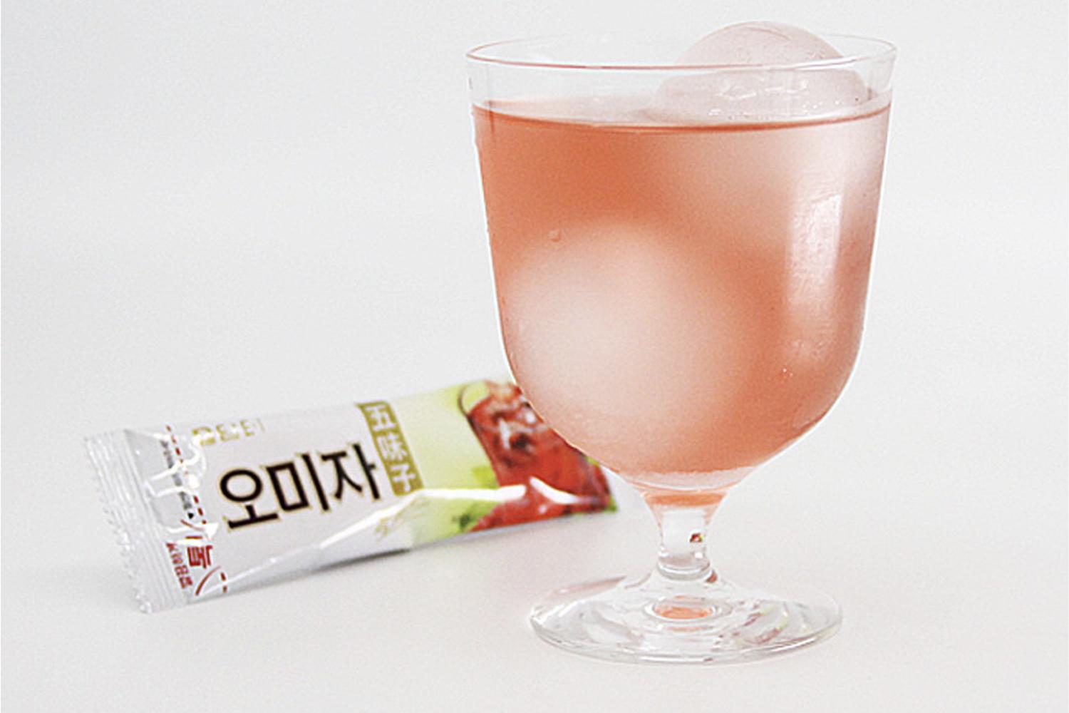 Korean brand damtuh's Omija Plus Tea made into an iced drink in glass