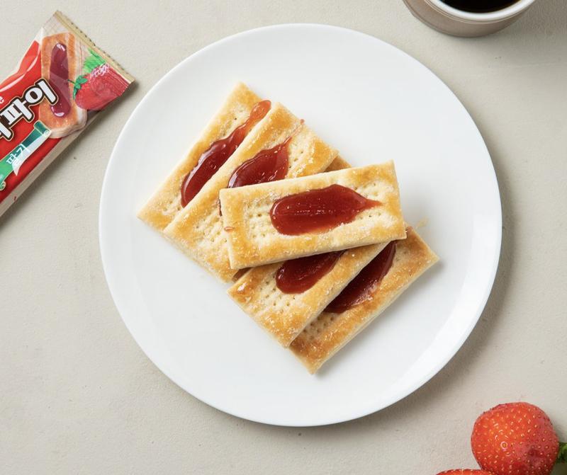 korean brand haitai's french pie strawberry flavor pies on plate with strawberry decoration