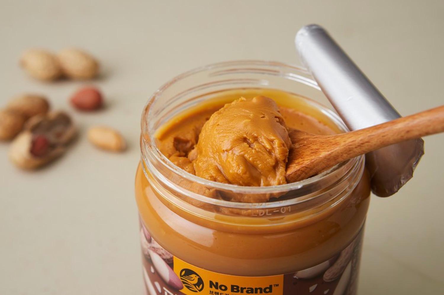 Korean brand no brand's crunchy peanut better opened with a spoon taking a scoop