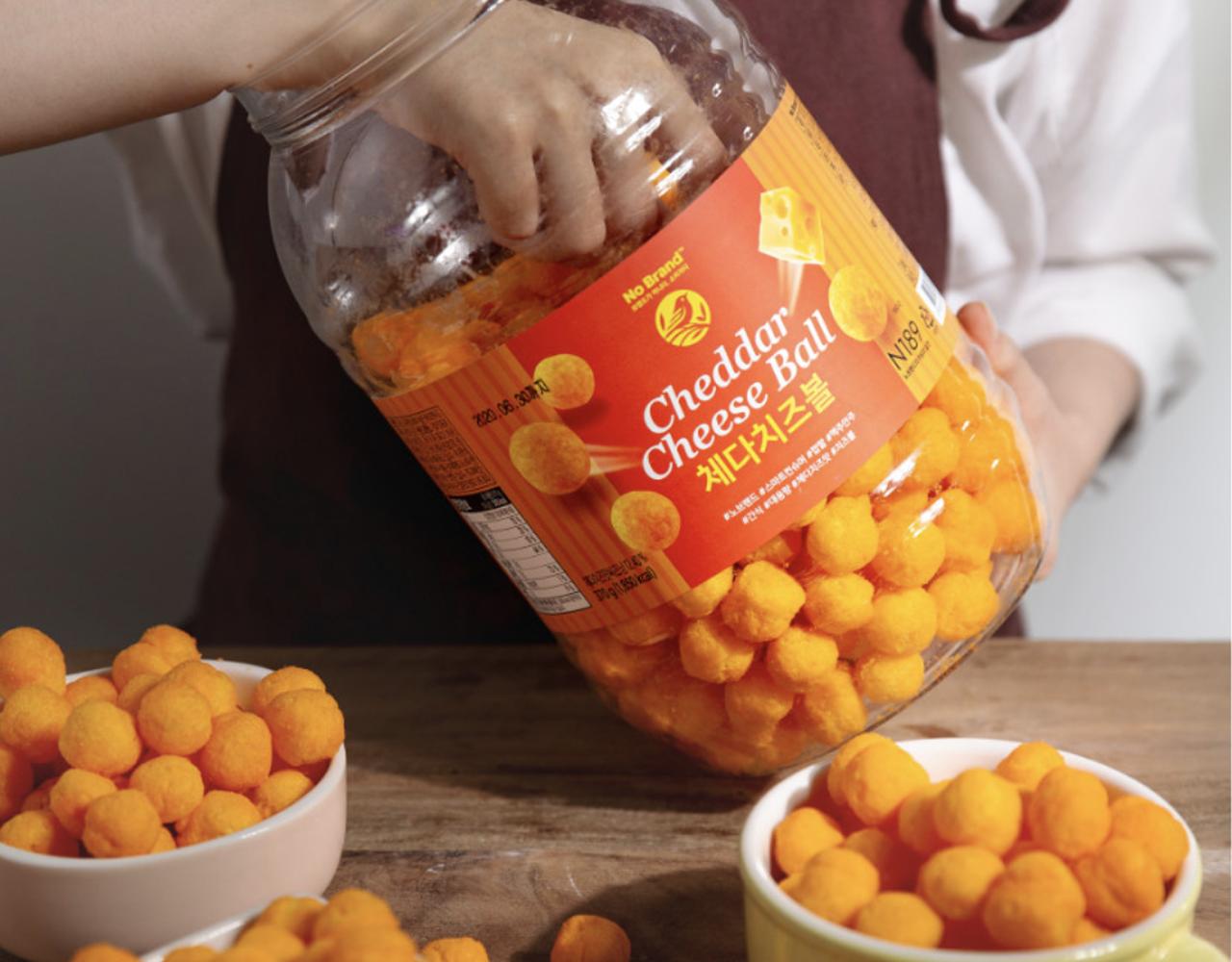open jar, and bowls full of korean brand no brand's cheddar cheese ball snack