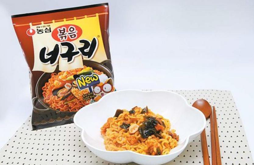 korean brand nongshim's stir-fried neoguri ramen pack next to prepared ramen