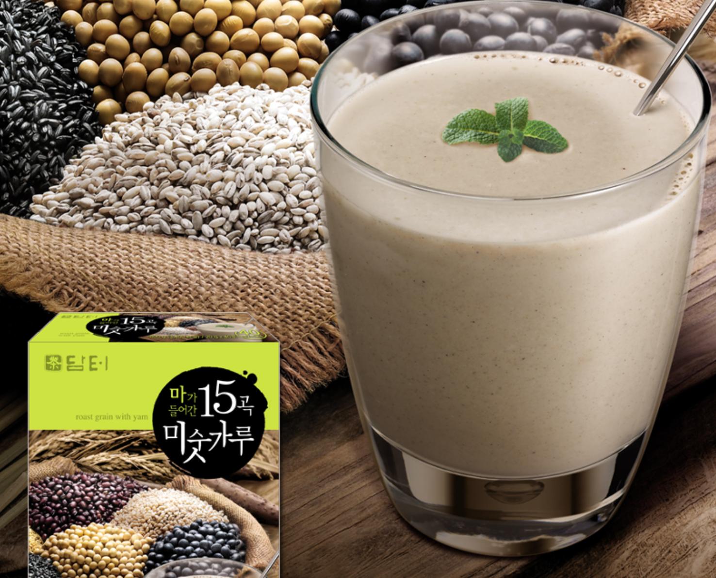 korean brand damtuh's 15 Roasted Grains Mixed Powder mixed into a drink with grains in the background 
