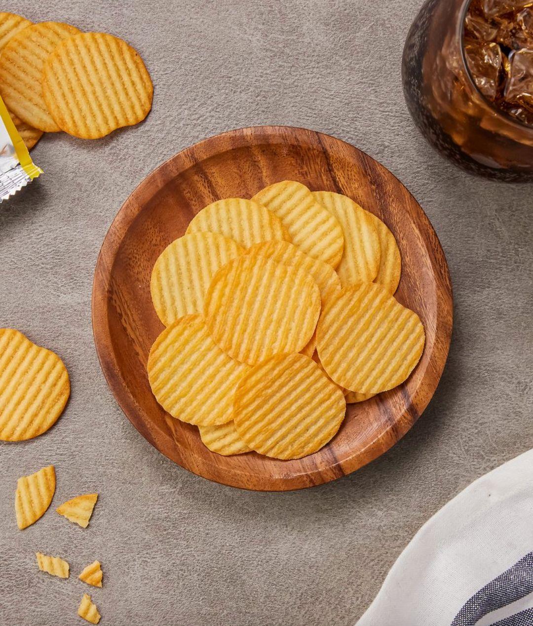 korean brand orion's yegam original flavor chips in a wooden bowl
