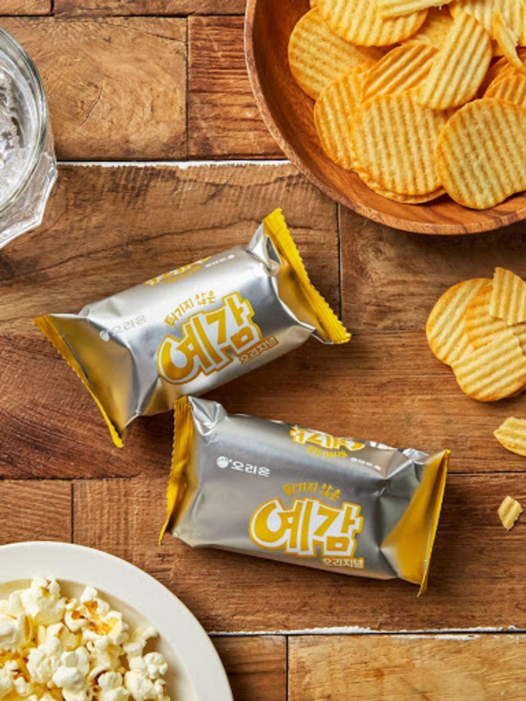 korean brand orion's yegam original flavor packs decorated with chips and popcorn