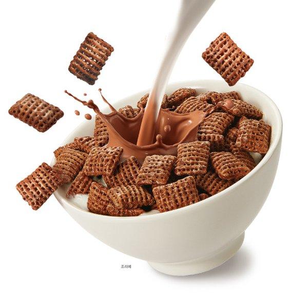 cartoonized bowl of chocolate flavored chex with milking being poured in