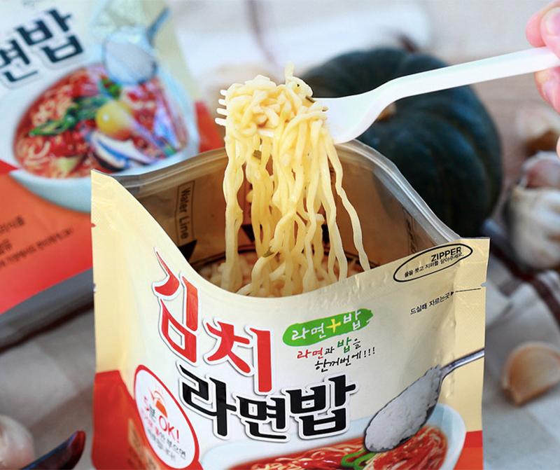 korean brand doori doori's kimchi ramen rice bag with fork full of ramen noodles